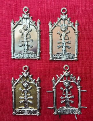 The pilgrim sign for St. Sebastian, shown with pewter, copper, and brass sheet backings, and with no backing.