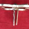Large double buckle with attachment plate shown from the side.